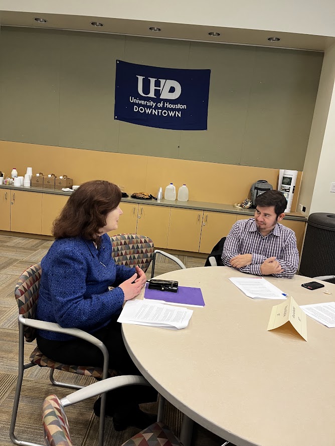 Faculty Research Symposium Provost having a discussion with faculty member