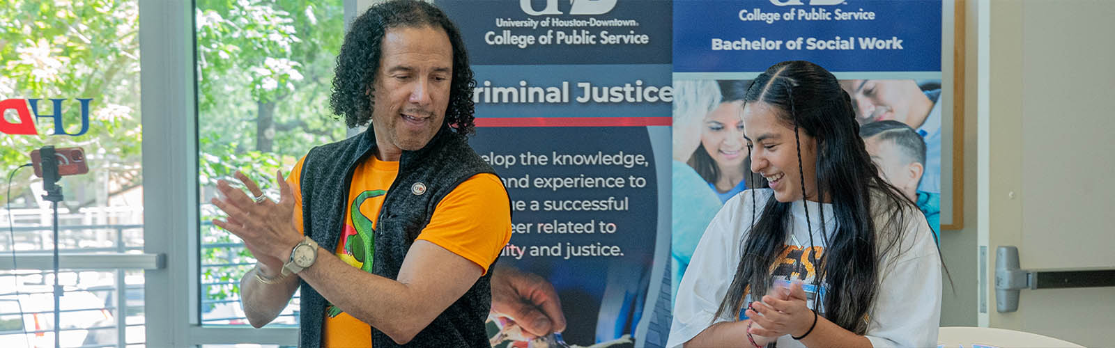 UHD Dean Dancing with student