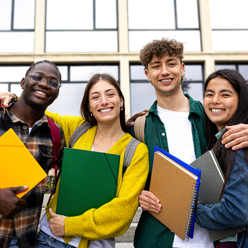 group of college students standing on stairs