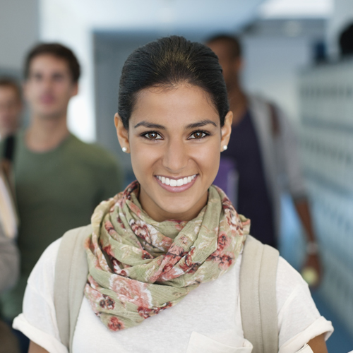 female student smiling at the camera