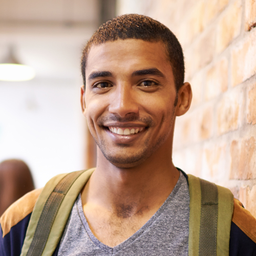 male student smiling at the camera