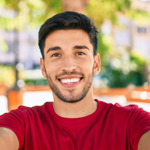 male student smiling at the camera