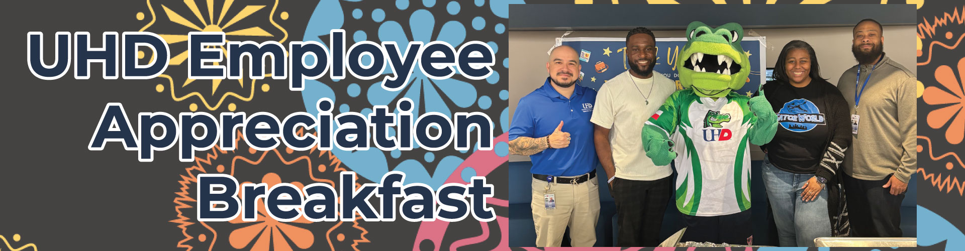 Staff members posing at the Employee Breakfast Event.
