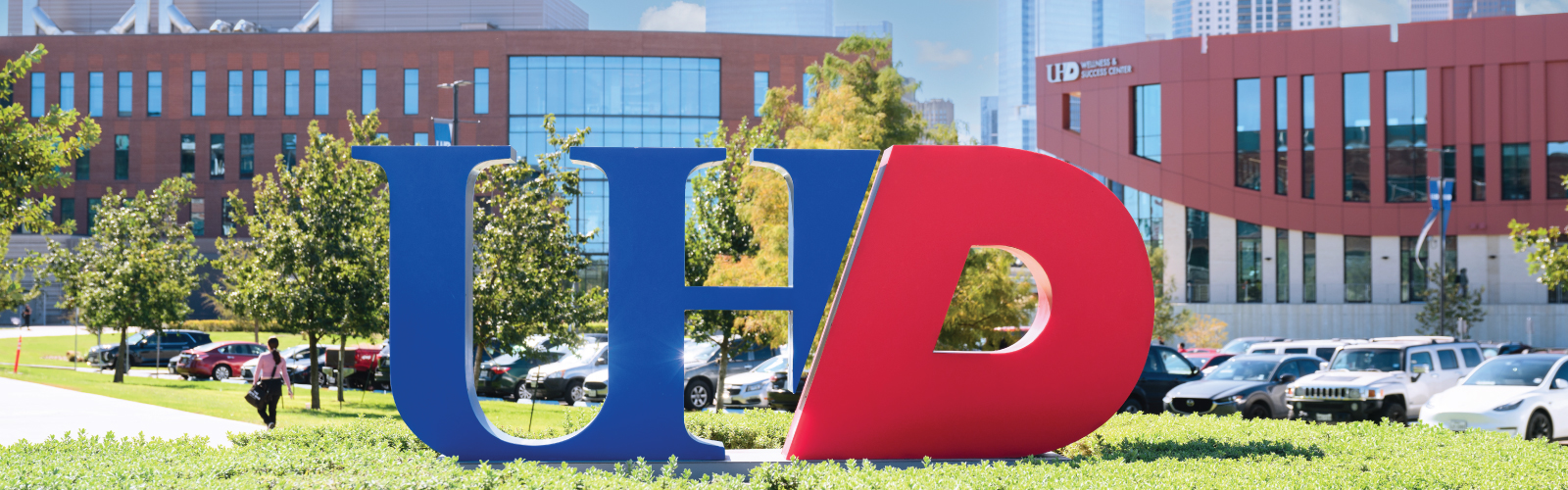 UHD logo outside with building as the background