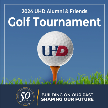 Golf ball on tee. UHD is emblazoned on the golf ball.