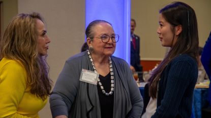 Donor scholar luncheon attendees talking