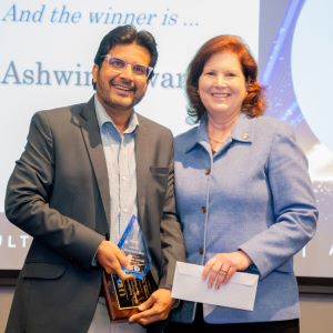 Ashwini Tiwari and Provost Bordelon posing for a photo on stage.