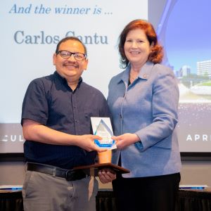 Carlos Cantu and Provost Bordelon posing for a photo on stage.