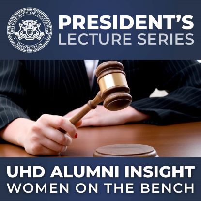 A hand holding a gavel with the words