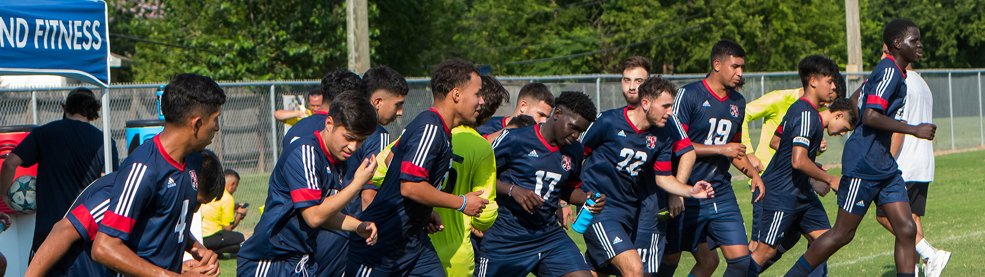 soccer team running onto the field