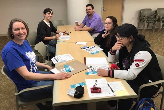 Members are sitting together and making events plan Students and Faculty at a WRC Event