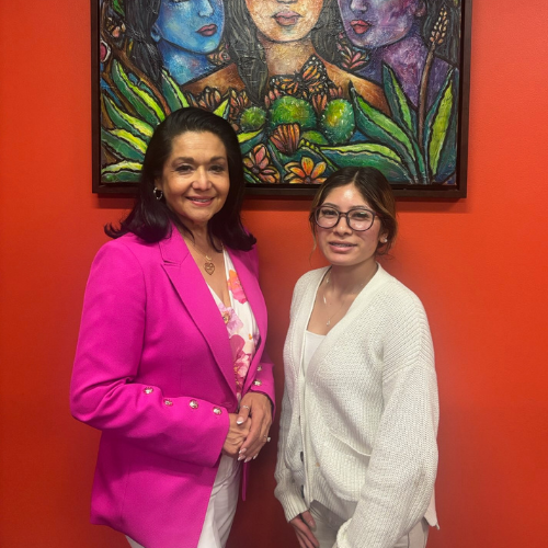 University of Houston Downtown alumna Paula Mendoza stands aside intern and marketing major Jocelynn Sanchez