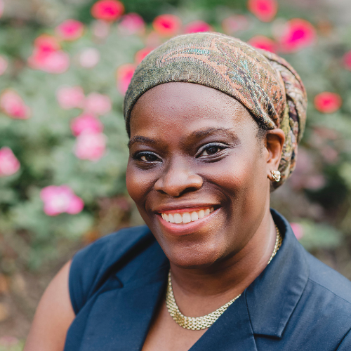 Yemi Brown UHD alumna smiles in a garden