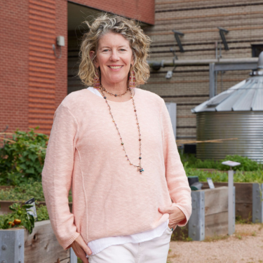 Director of the University of Houston-Downtown's Center for Urban Agriculture and Sustainability, Dr. Lisa Morano, in the university's sustainability garden.