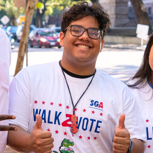Maximiliano Perez poses in a Walk2Vote t-shirt