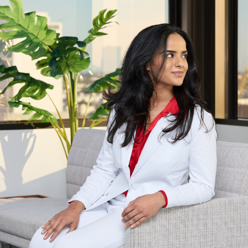 University student Shvangi Pathak smiles while wearing a pant suit at University of Houston Downtown's Law Summit at UHD@1801 Main in downtown houston