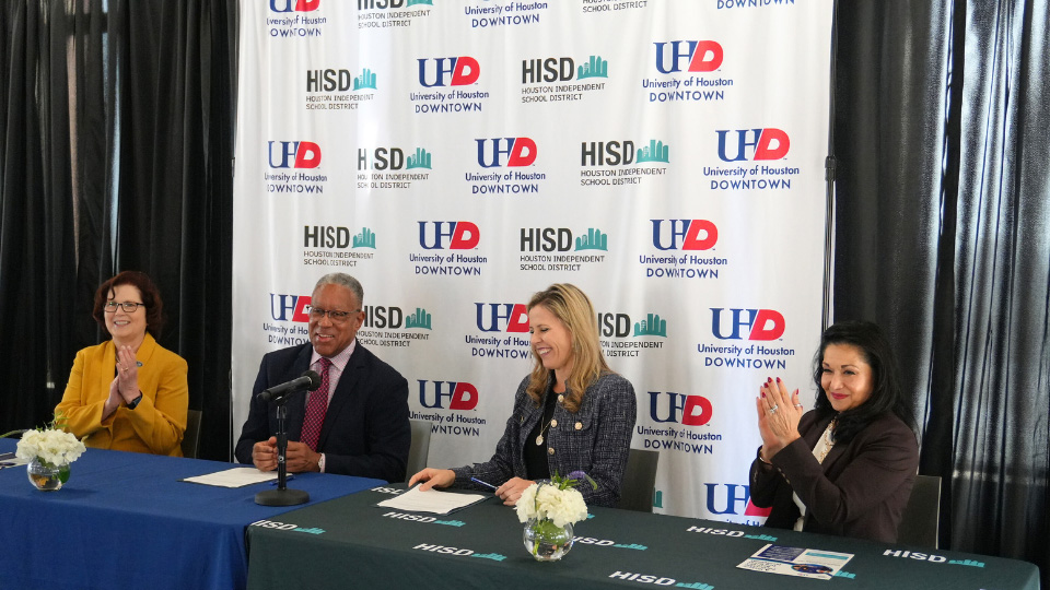 President Loren J Blanchard with HISD chief academic officer Kristen Hole and UHD alumna and HISD board member Paula Mendoza